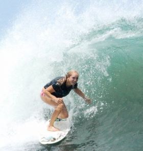 Kristin Wilson surfing in the tube – Best Places In The World To Retire – International Living